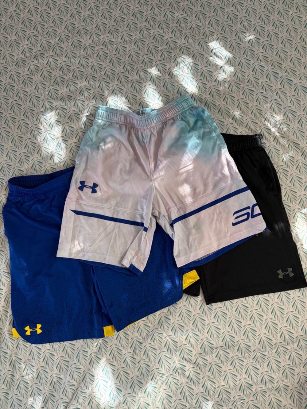3 pairs boys Under Armour shorts, size little boys medium.